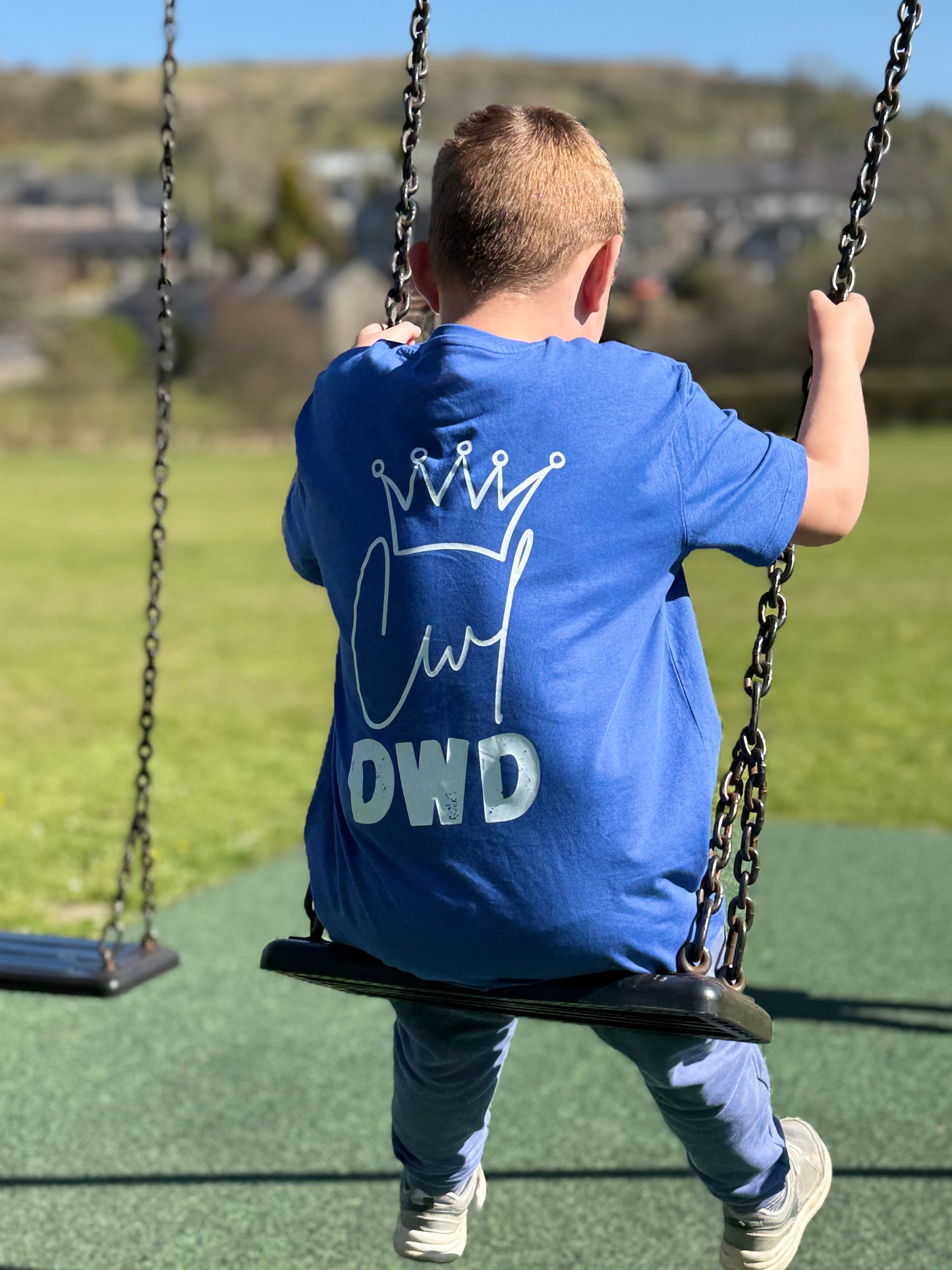printed cwl dwd design with a handdrawn crown on the back of a tshirt