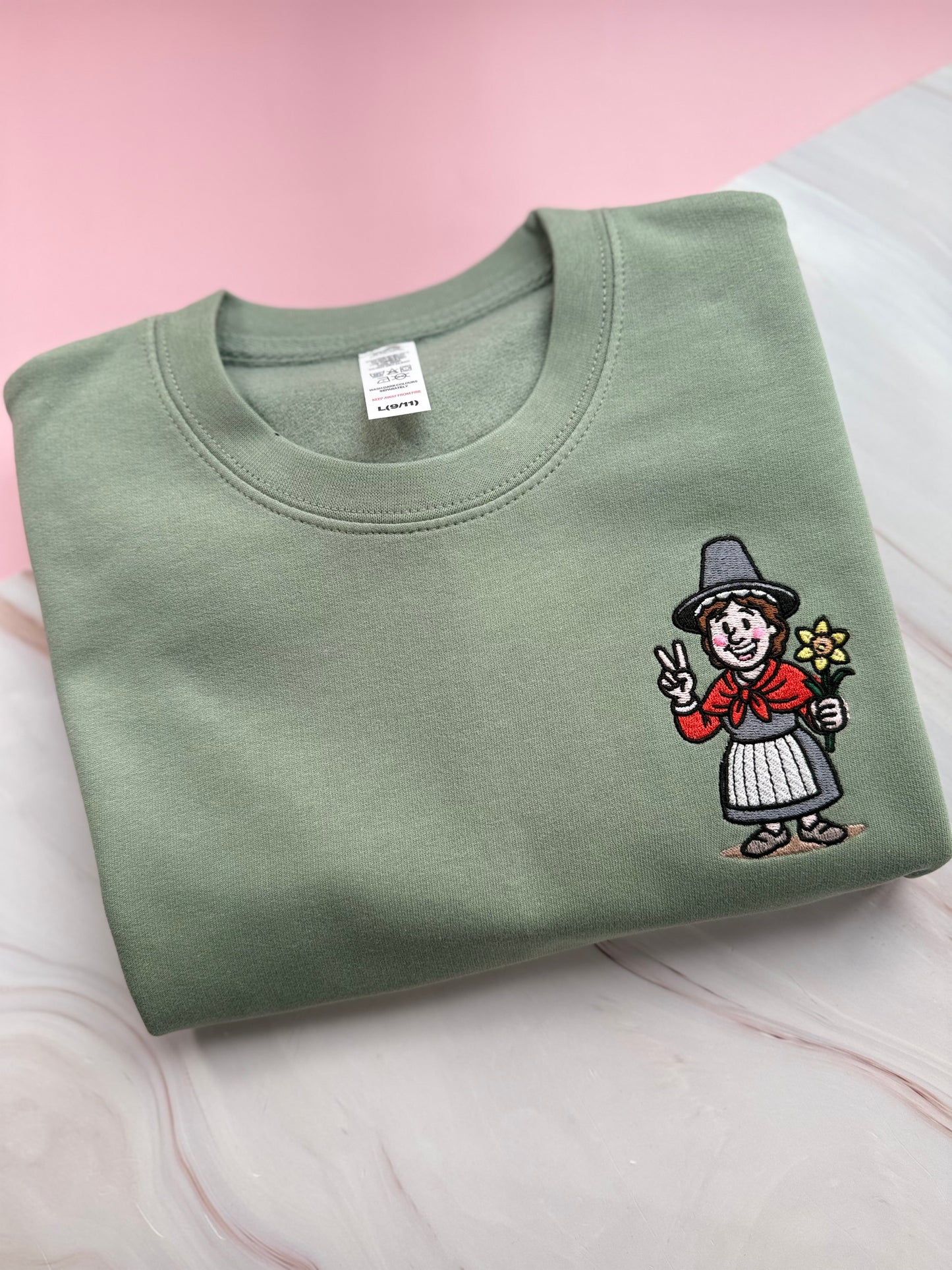 Embroidered Dusty Green  jumper with Welsh lady Miri Machno