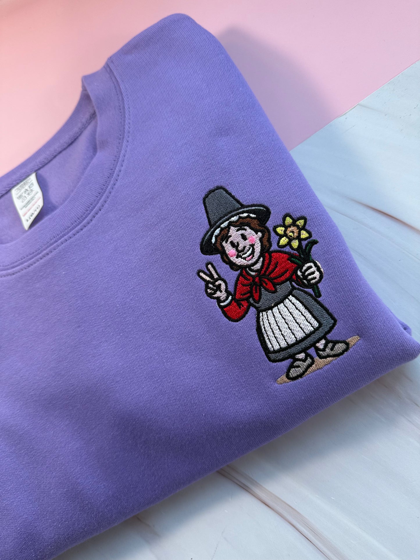 Embroidered digital lavender purple jumper with Welsh lady Miri Machno 