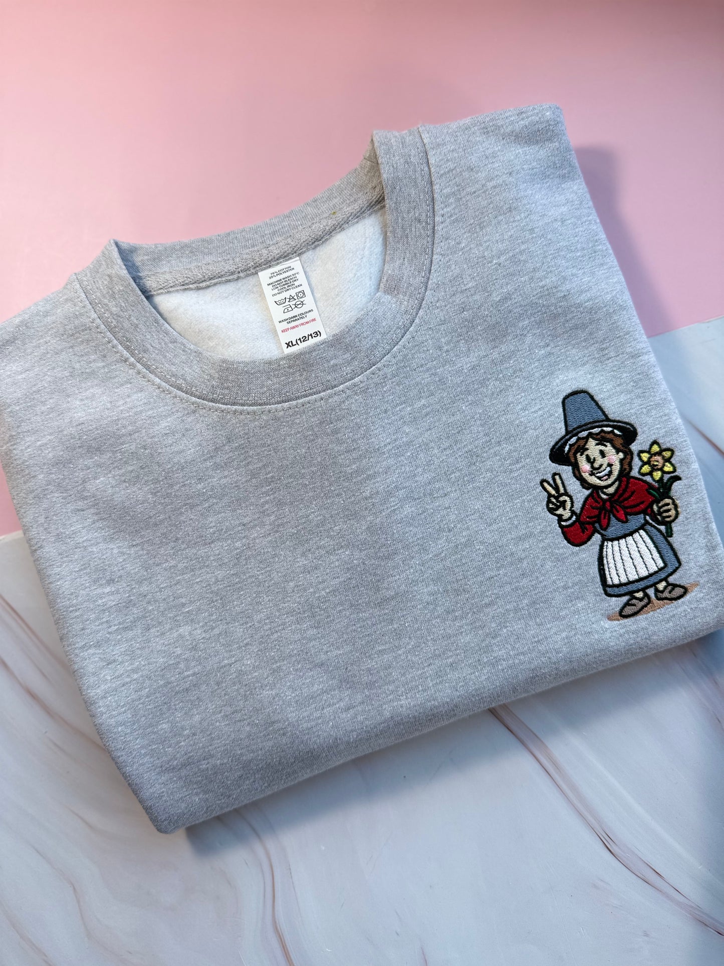 Embroidered heather grey jumper with Welsh lady Miri Machno embroidered 