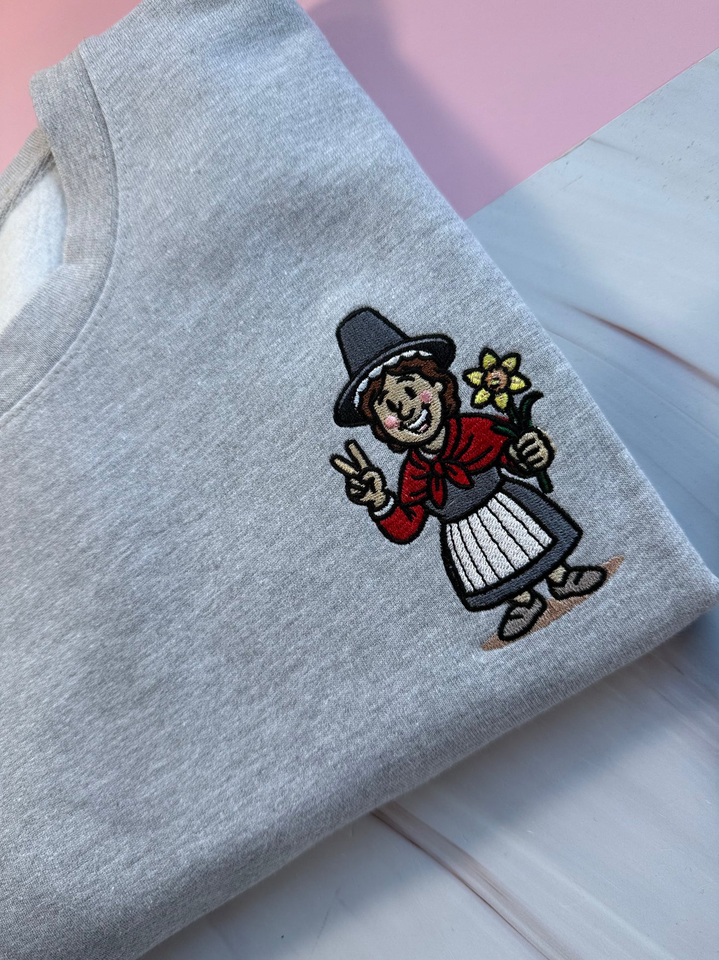 Embroidered heather grey jumper with Welsh lady Miri Machno embroidered 