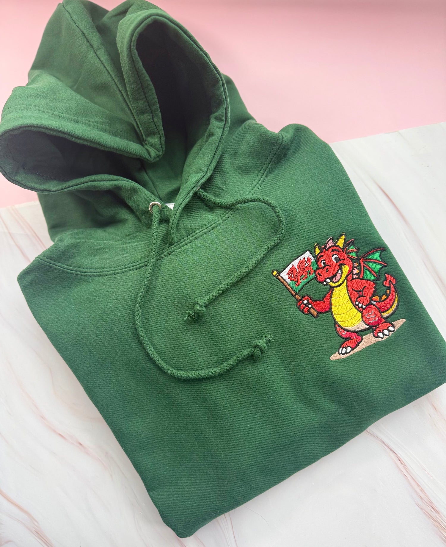 Bottle green hoodie embroidered with Macs Machno Welsh dragon 